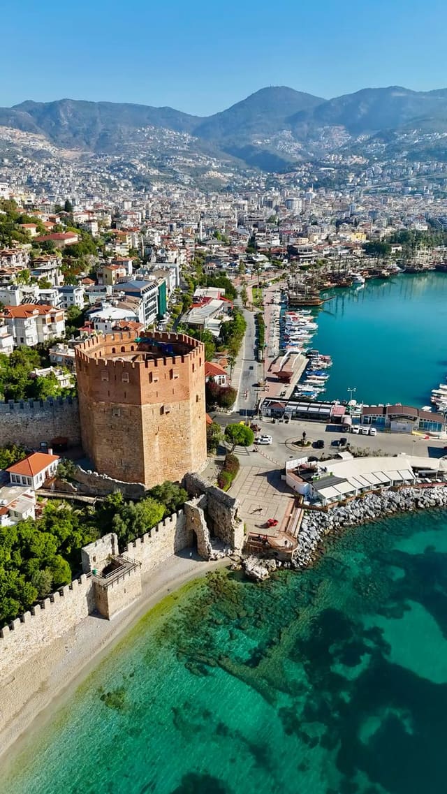 The historic Red Tower and castle walls above Alanya harbour