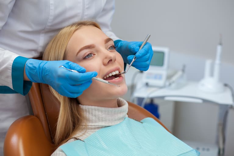 Teeth Cleaning being carried out in a clinical setting